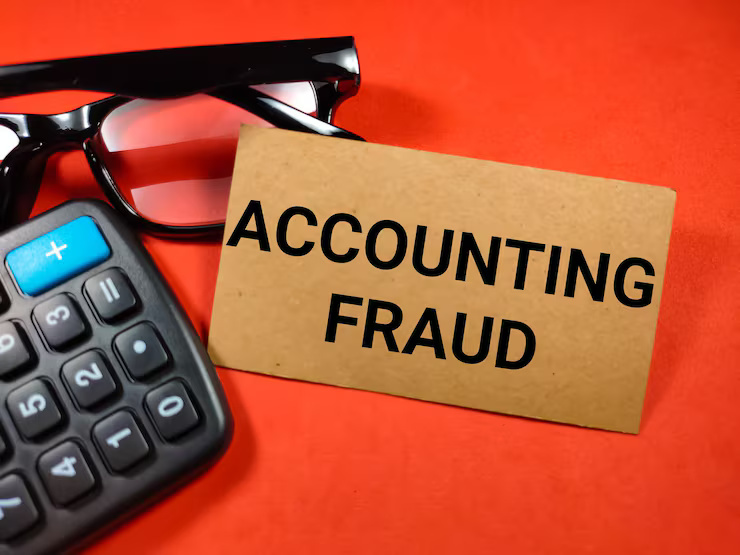 business-concepttext-accounting-fraud-with-glasses-calculator-red-background_406607-4695