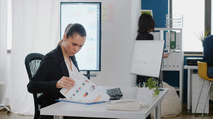 business-manager-checking-data-charts-with-files-computer-strategy-planning-analysis-engineer-working-corporate-project-with-monitor-technology-office-desk_482257-39885