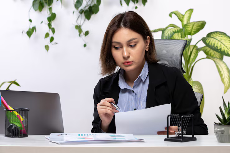 front-view-beautiful-young-businesswoman-black-jacket-blue-shirt-working-with-laptop-documents-front-table-business-job-office_140725-15860